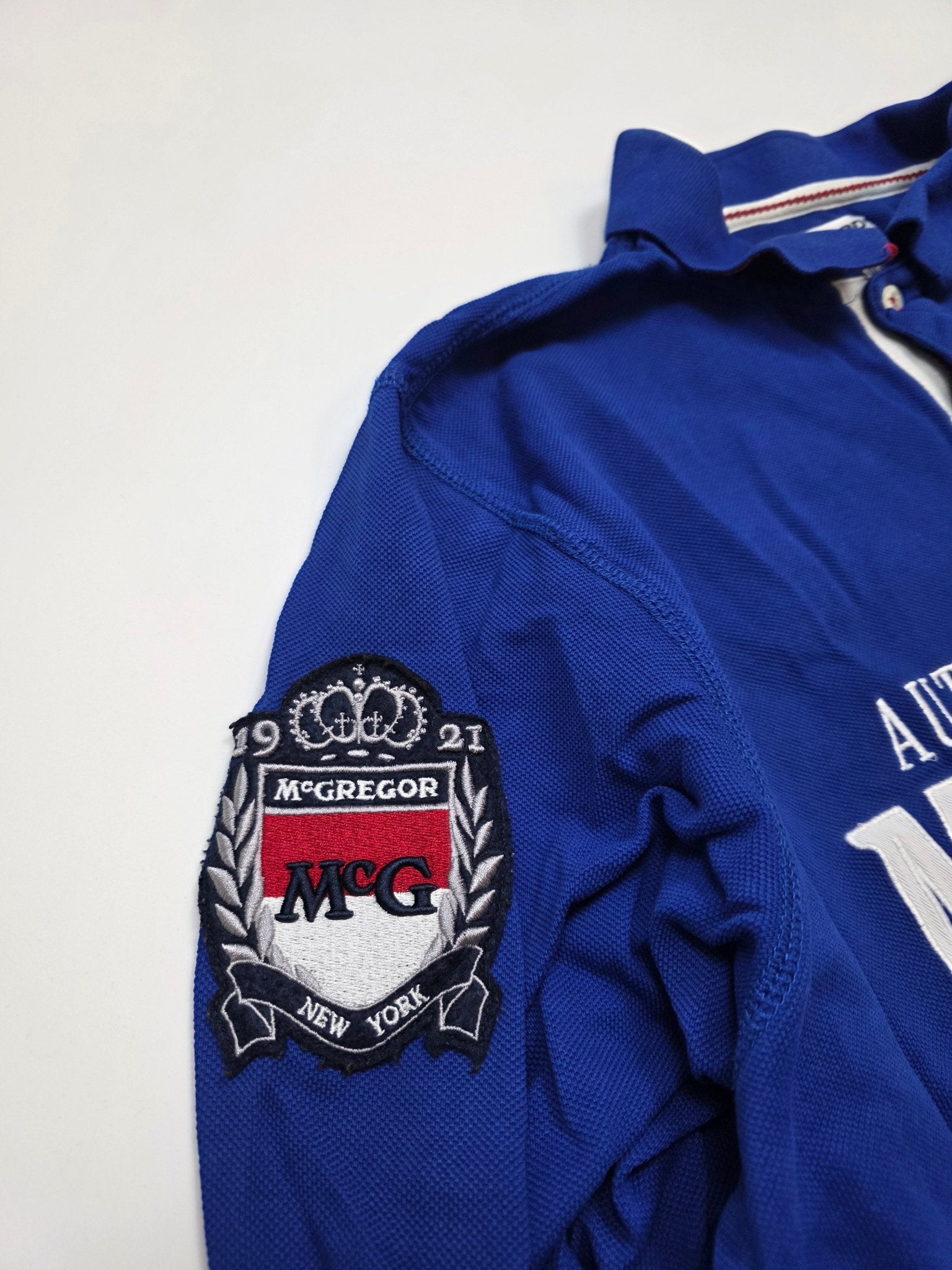 McGregor Patch am Ärmel des blauen Rallye Monte Carlo Vintage Poloshirts