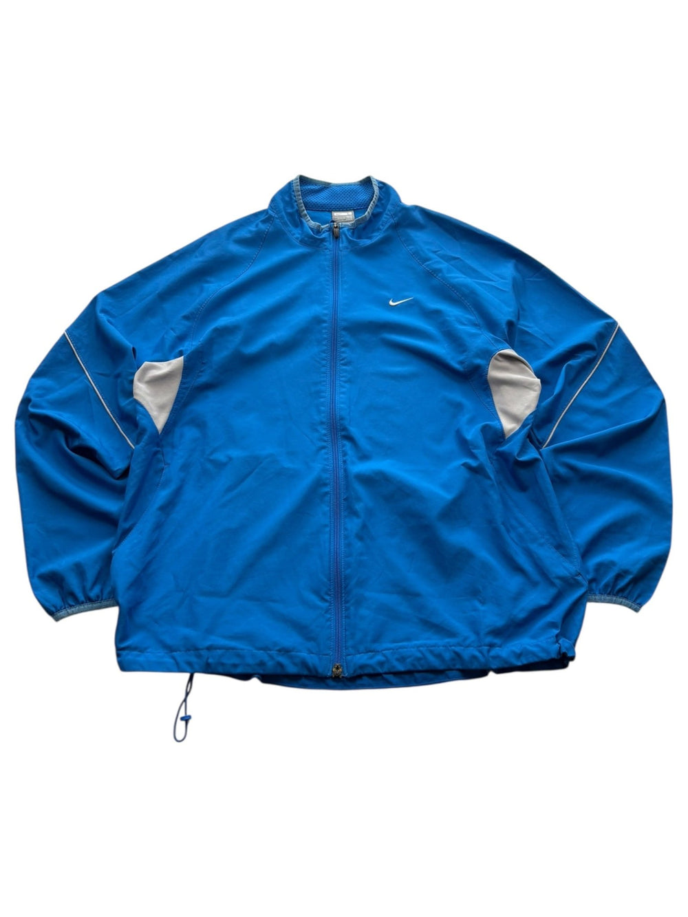 Blaue Nike Two-Tone Vintage Trackjacket mit grauen Ärmelpanels und weißem Swoosh