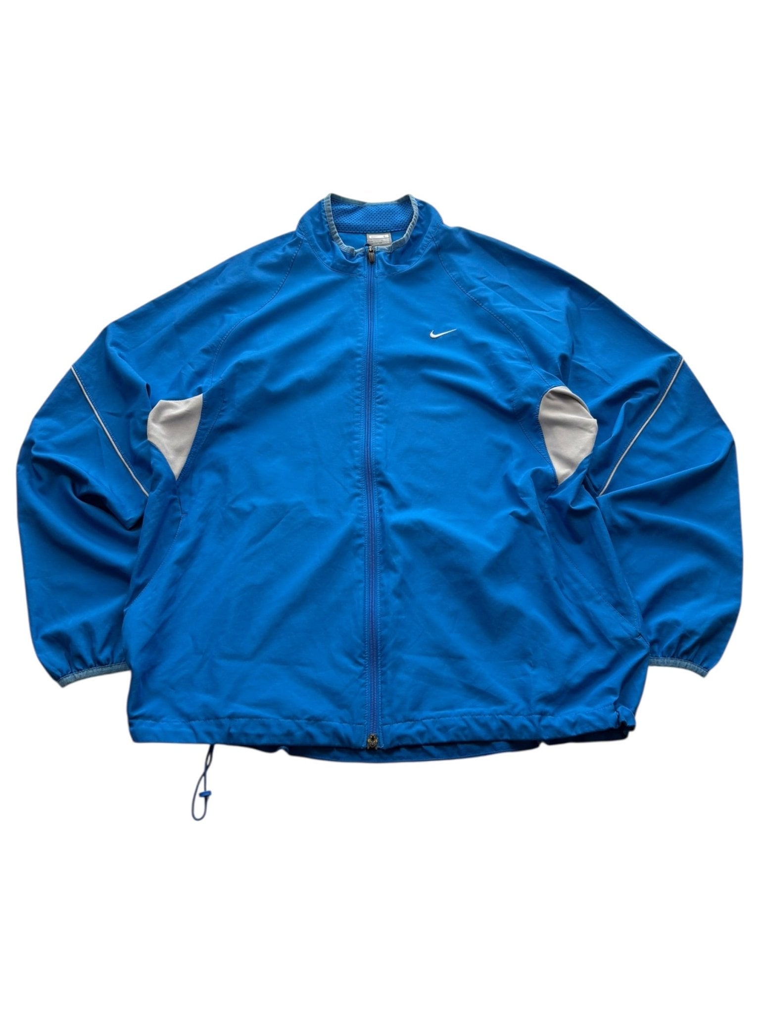 Blaue Nike Two-Tone Vintage Trackjacket mit grauen Ärmelpanels und weißem Swoosh